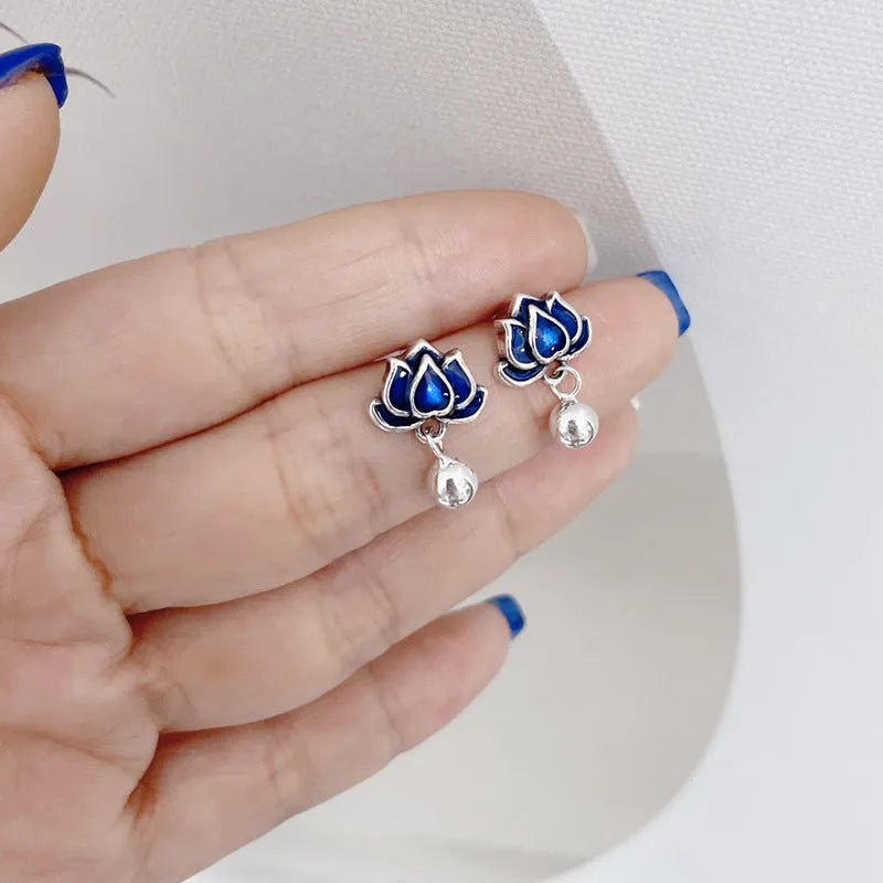 Blue lotus flower stud earrings with a detailed seedpod tassel drop, retro design.