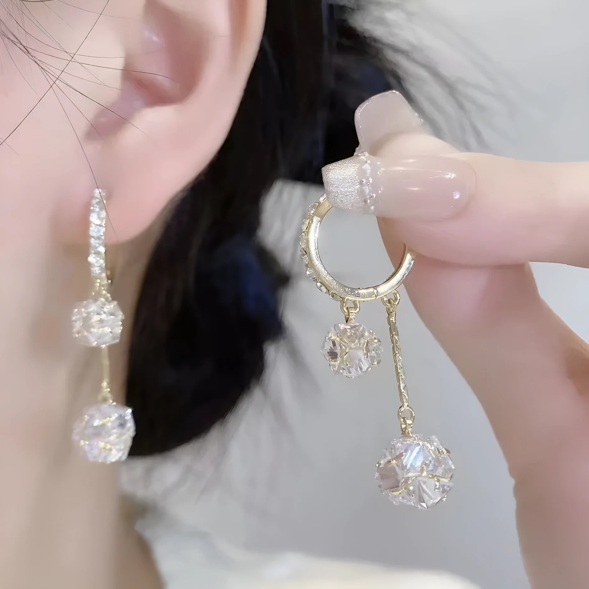 Silver balloon confession tassel earrings with rhinestone ball and drop shape design
