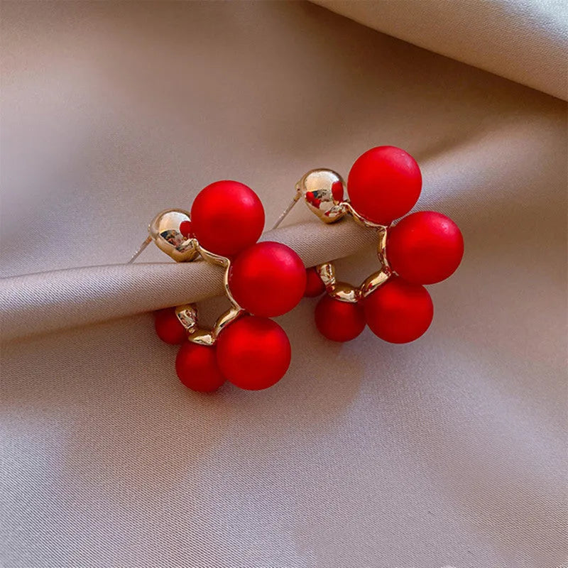 Red bell-shaped drop earrings for women with alloy construction, shown in red and white colour options