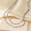 Geometric titanium steel pendant on adjustable snake bone chain necklace showing double-layer twist design
