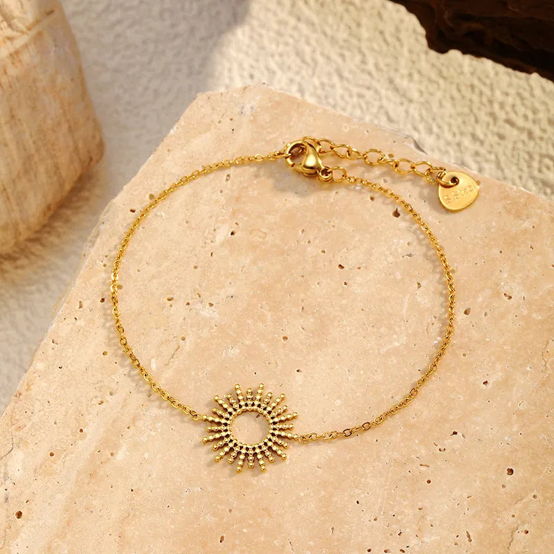 SUNFLOWER Series 14K gold necklace and bracelet set with geometric chain design on white background