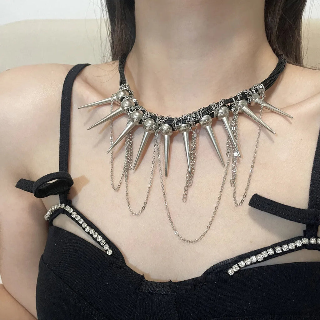 Women's rivet round beads winding tassel necklace with leather cord and electroplated brass accents.