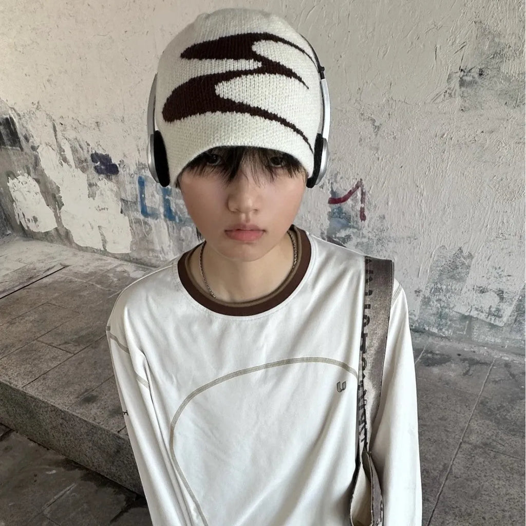 Acrylic thermal knit beanie hat in black, shown on a model, illustrating its textured anti-fall design.