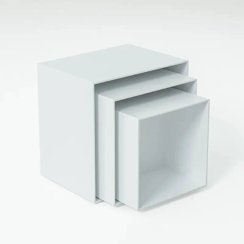 White plastic stackable dessert display stand with six pieces arranged in tiered formation