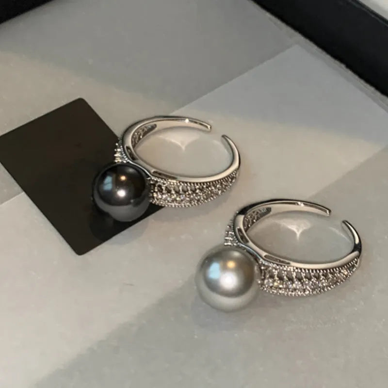 Geometric open ring with black pearl on adjustable copper band for women