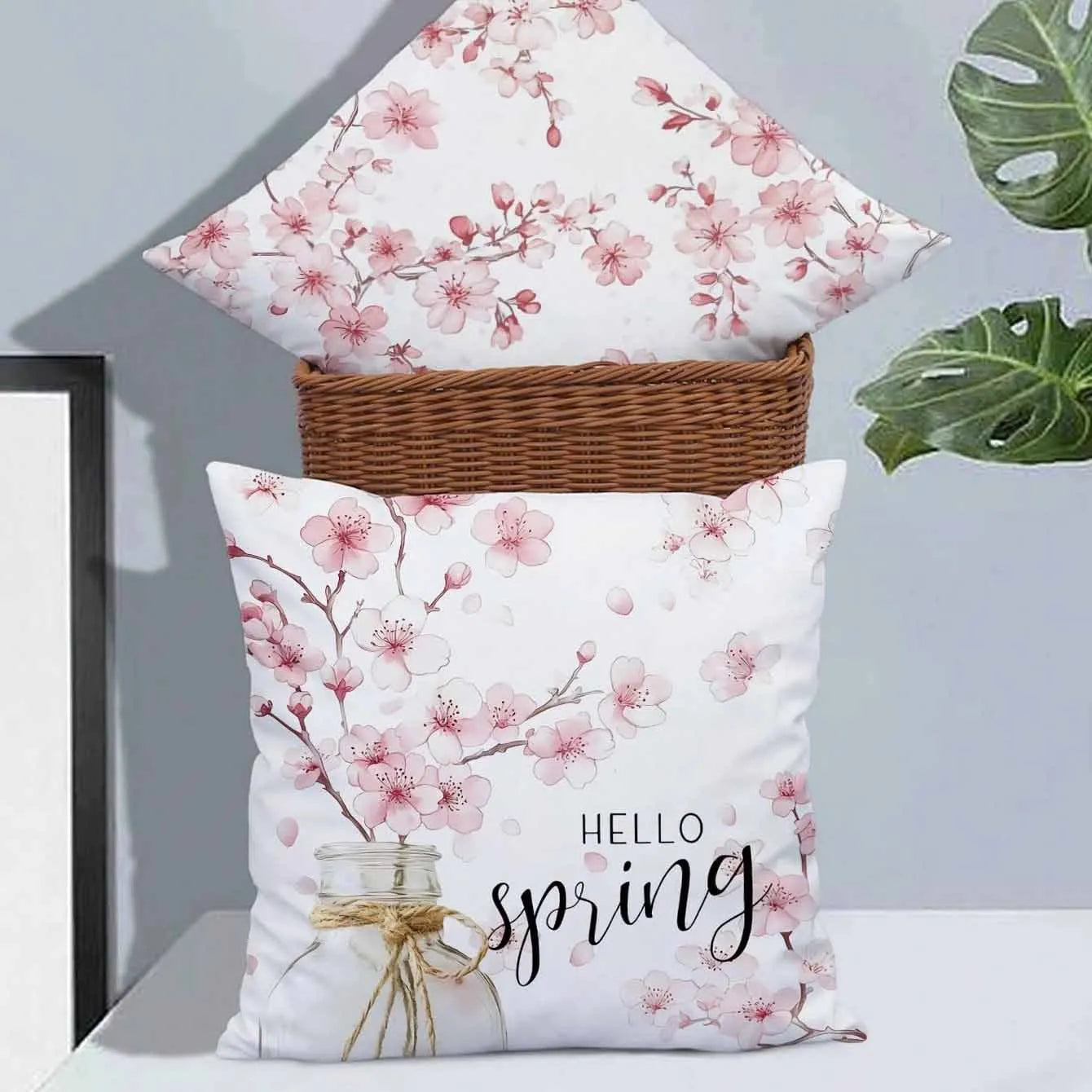 Square short velvet cushion cover with Spring Cherry Blossom Letter floral design, 45cm by 45cm.