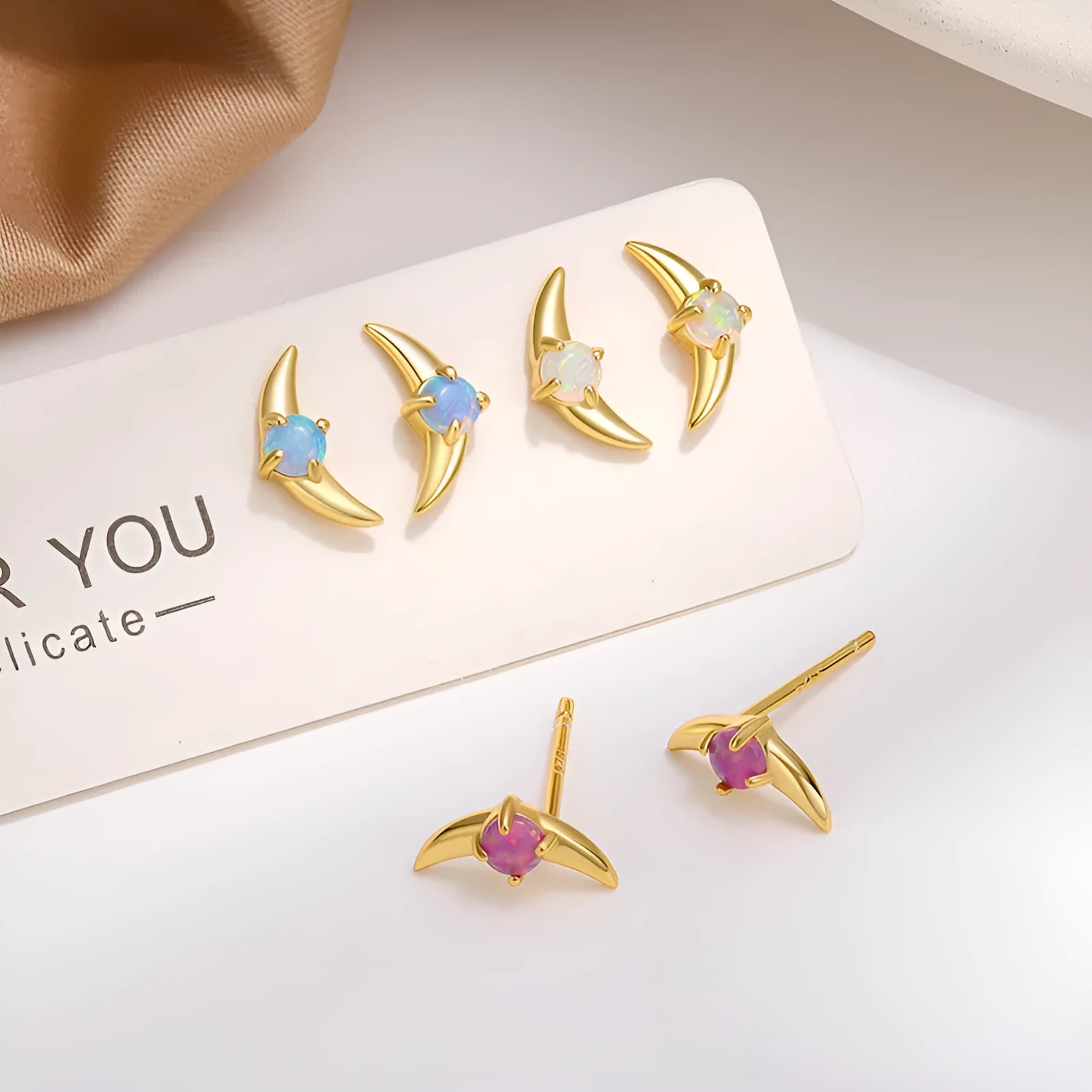 925 silver geometric earrings with electroplated gold finish and blue stone