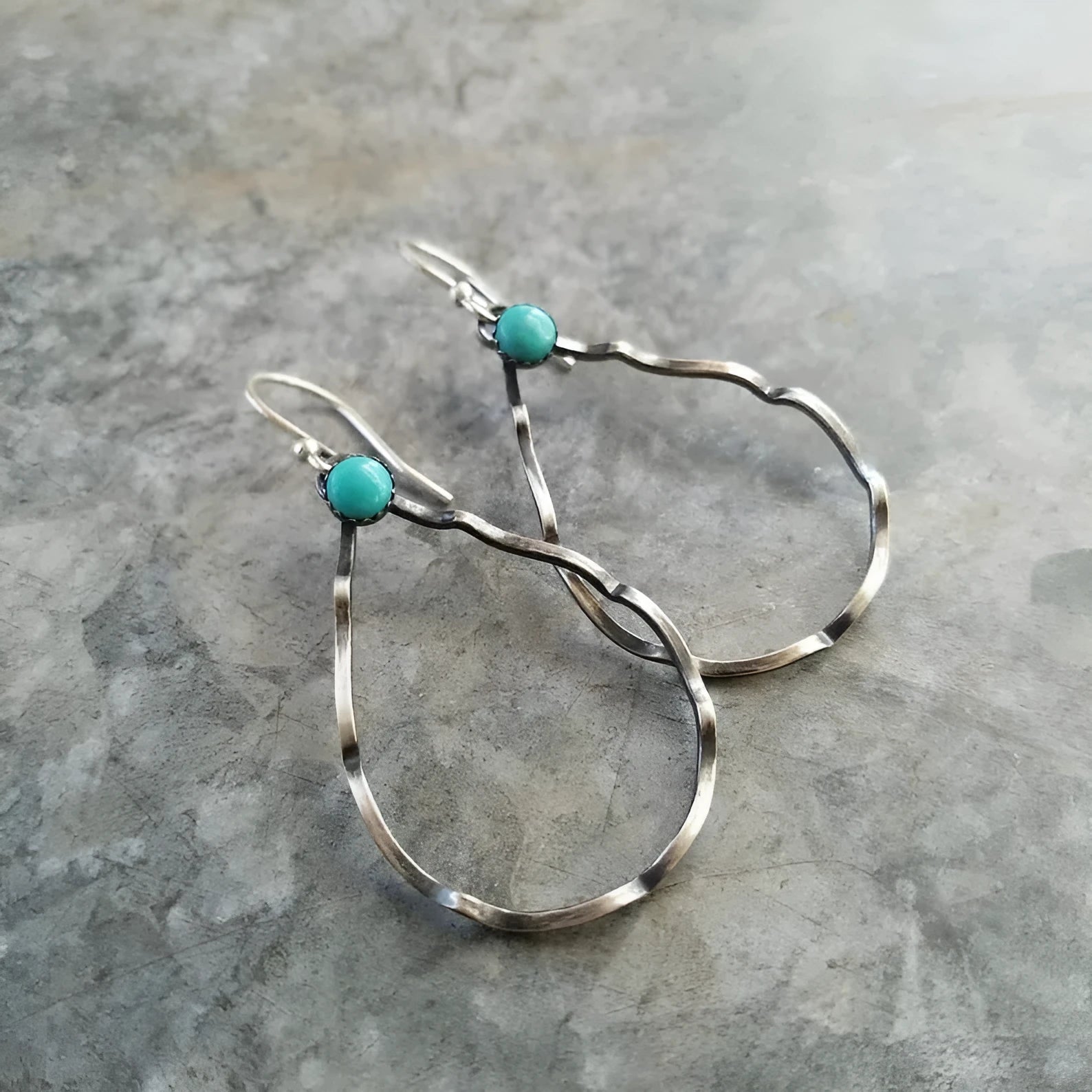 Circular bohemian style earrings with geometric design in antique silver finish