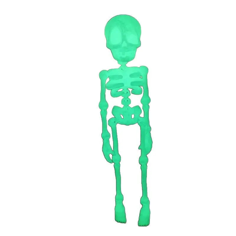 3D-printed white skull Halloween fridge magnet ornament on a refrigerator door.
