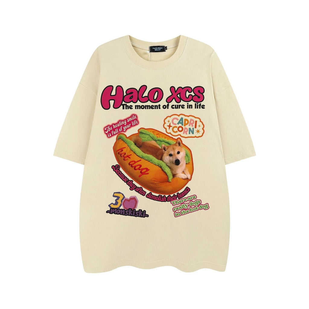 White cotton t-shirt with a cartoon print of a hamburger and a dog, showing a round neck and short sleeves.