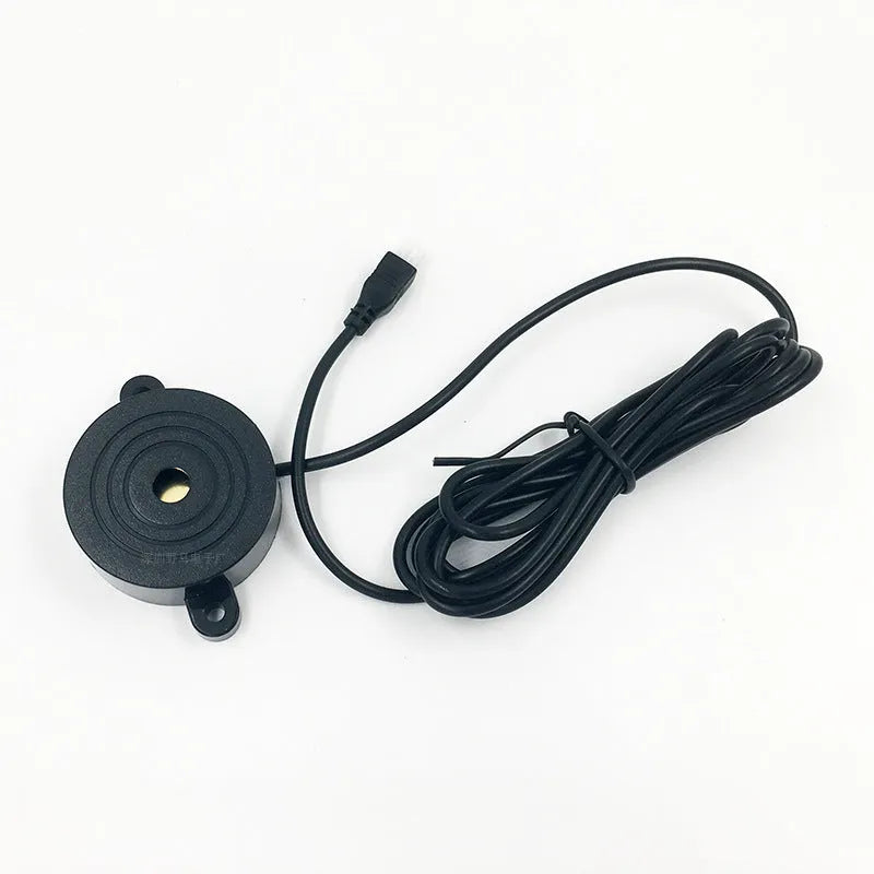 Four ultrasonic parking sensors and a buzzer control unit for a car reversing radar system.