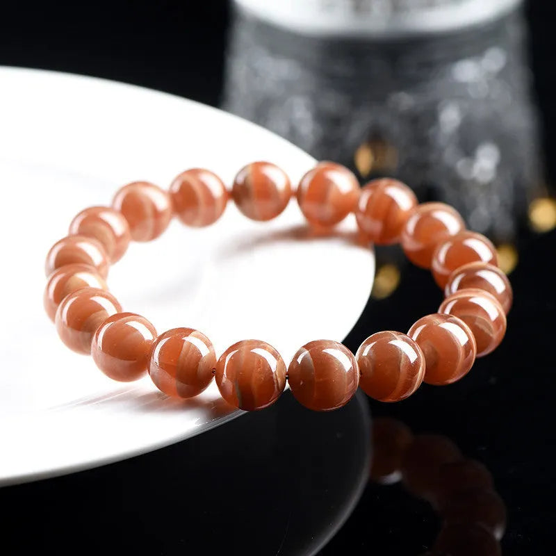 Peruvian rhodochrosite bracelet with geometric round beads in traditional ruyi design