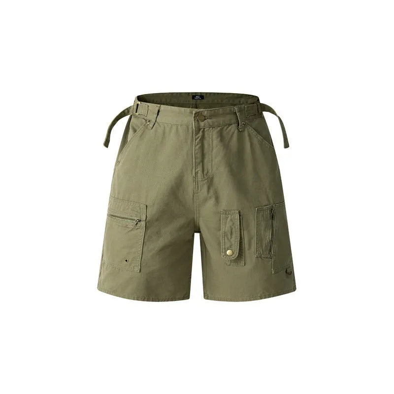 Retro loose-fit washed cotton workwear shorts for men and women on a hanger, showing zip fly and fifth-pants length.