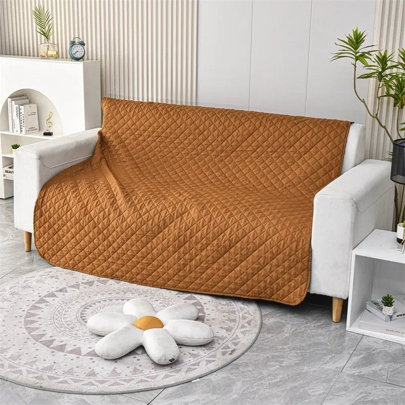 Waterproof reversible dog blanket on a sofa, showing two colour sides, with size chart for nine options.