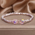 Colourful artificial crystal butterfly bracelet in blue, dark pink, and light pink, handcrafted with ethnic style for women