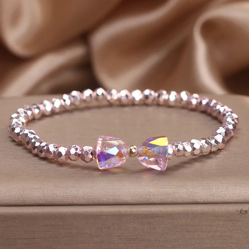 Colourful artificial crystal butterfly bracelet in blue, dark pink, and light pink, handcrafted with ethnic style for women