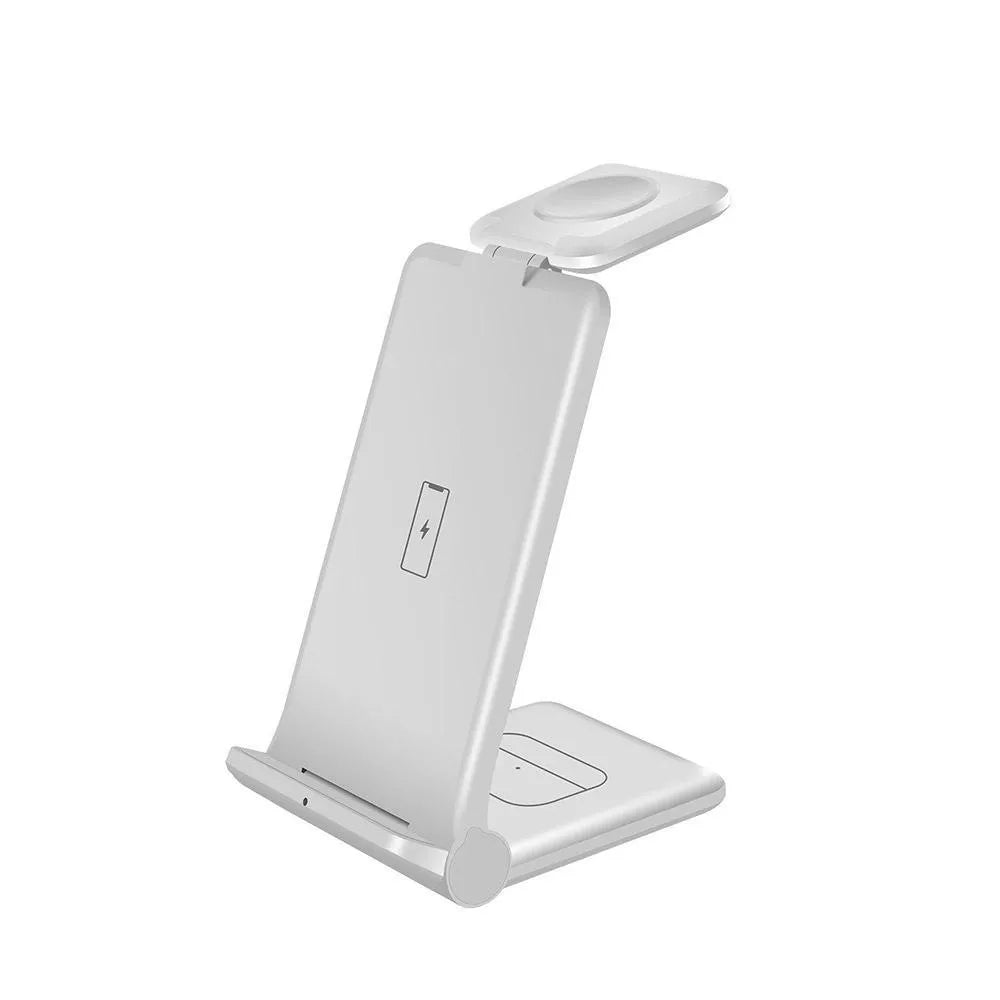 White 3-in-1 foldable wireless charging station for phone, Apple Watch, and AirPods on a desk.