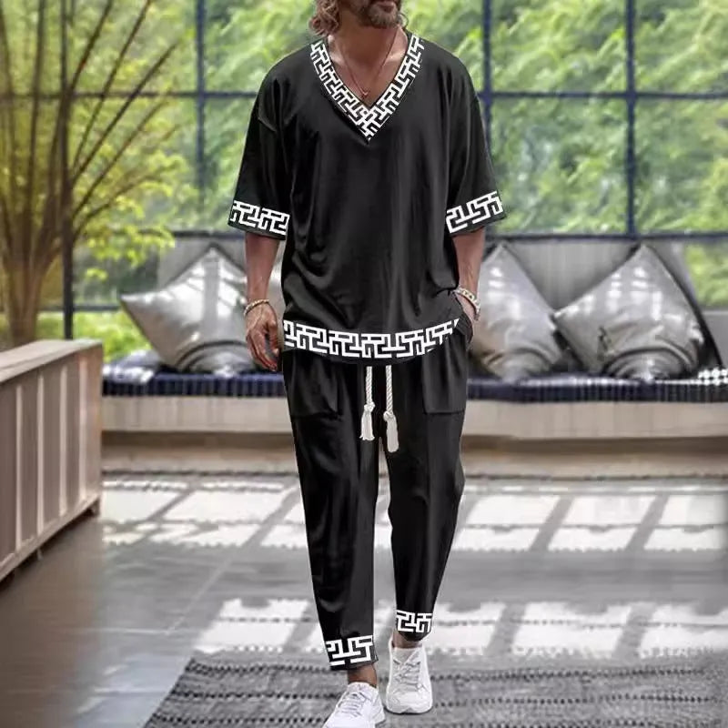 Women's grey V-neck cropped sleeve tracksuit set with matching trousers on a hanger