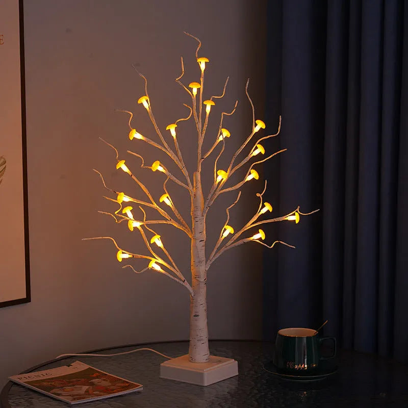 60cm tall white birch tree LED lamp with 24 small lit mushroom flowers on its branches.
