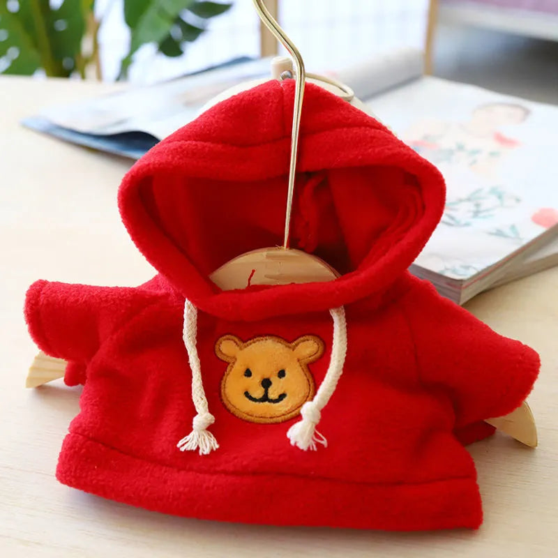 A dog wearing a blue cloth hoodie sweater, showing the casual hoodie style.