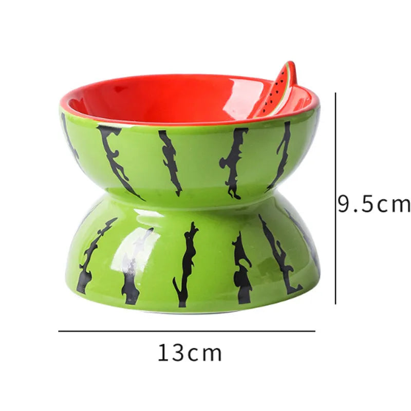 Orange patterned ceramic elevated cat bowl on a white surface
