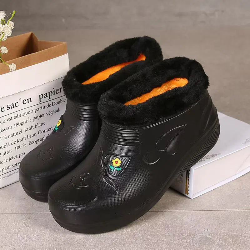 Unisex waterproof fleece-lined rain boots with anti-slip EVA sole in black, side view