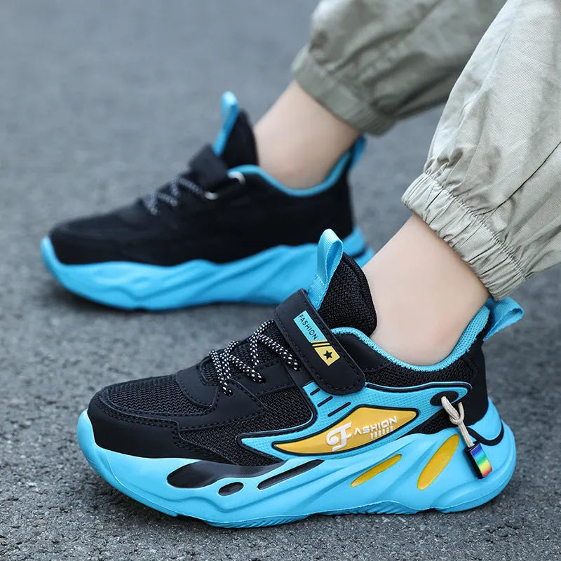 Boys dark blue and beige sports running shoes with Velcro strap and mesh upper.