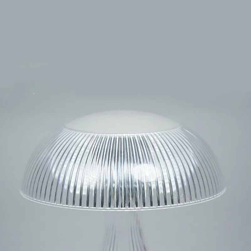 Small white acrylic touch-control night lamp with USB charging cable.