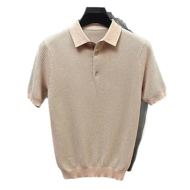 Loose fit grey cotton short sleeve pullover sweater laid flat.