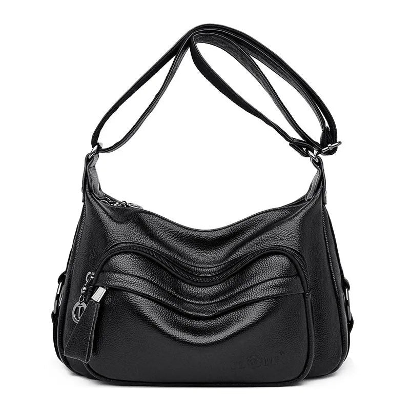 Large blue PU leather crossbody bag for women showing horizontal square shape and internal organiser pockets.