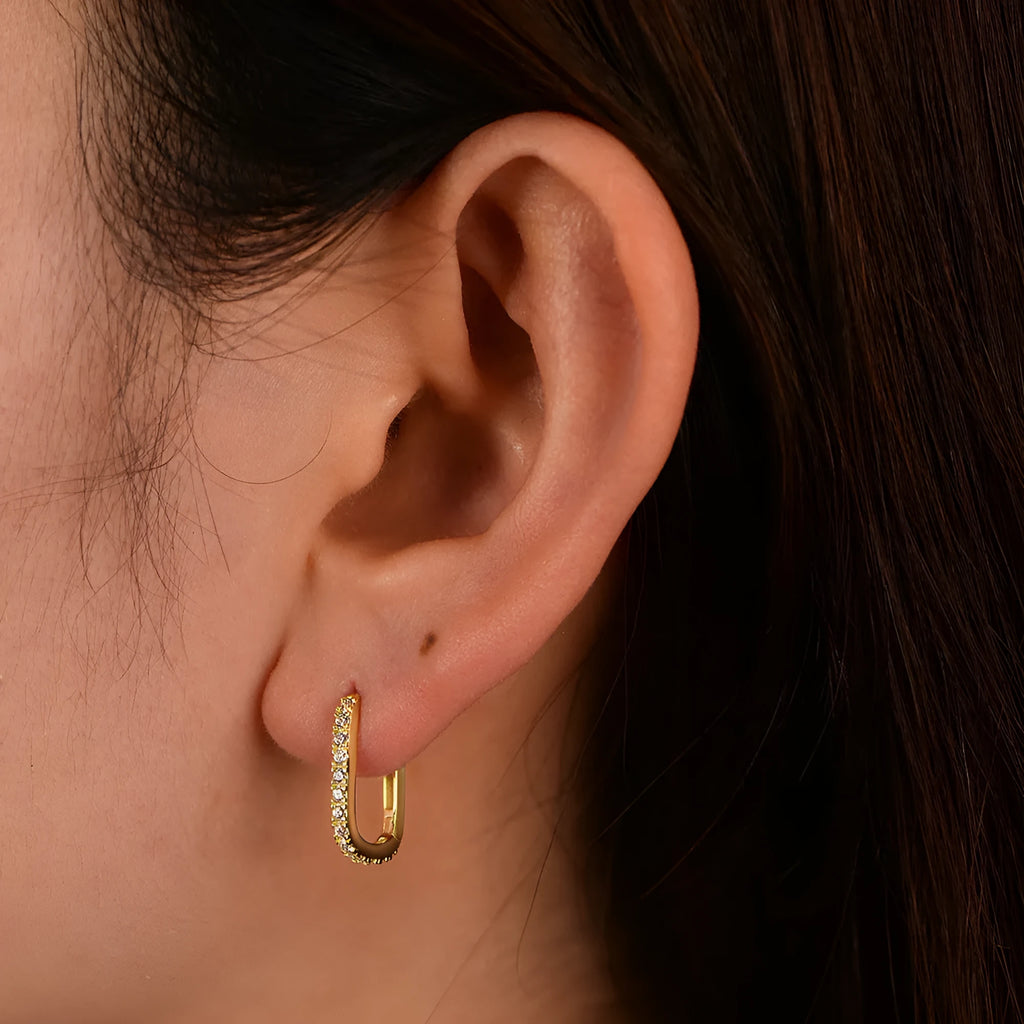 Women's oval zircon geometric earrings in sterling silver with ear clip fitting.