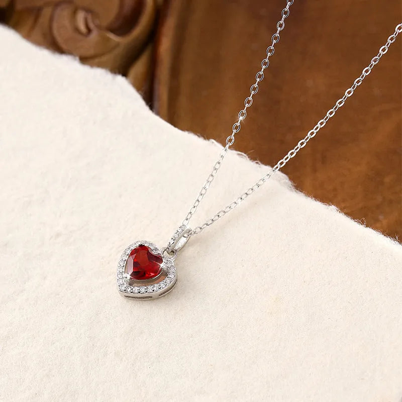 Sterling silver heart pendant necklace with natural coloured gemstone on adjustable cross chain