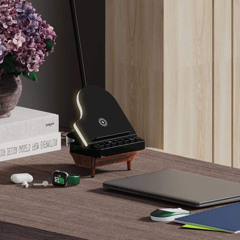 Black multi-function Bluetooth speaker with wireless charger and phone holder on a desk
