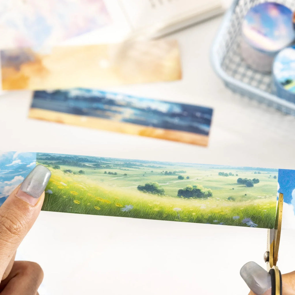 Roll of Japanese paper decorative tape with sky theme designs including clouds and nebula patterns