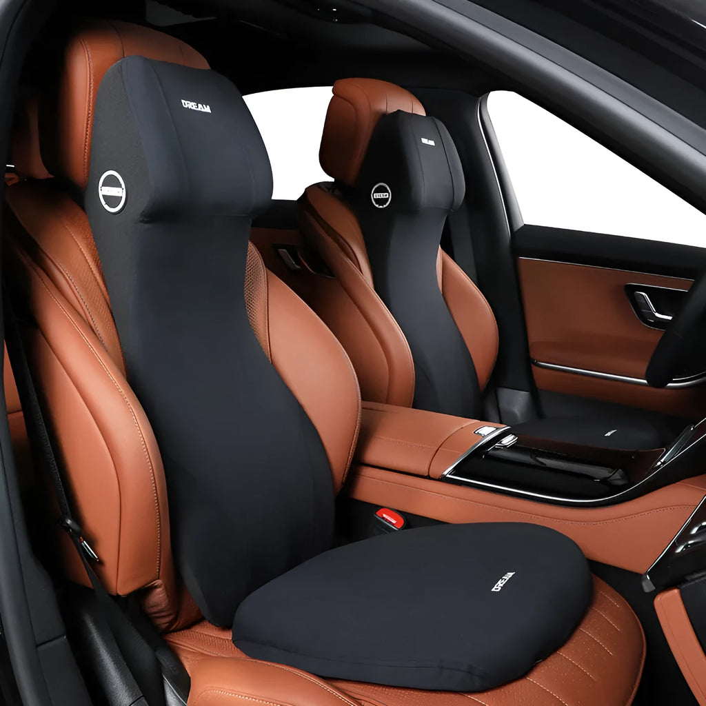 Black integrated memory foam car cushion and lumbar support pillow on a car seat.