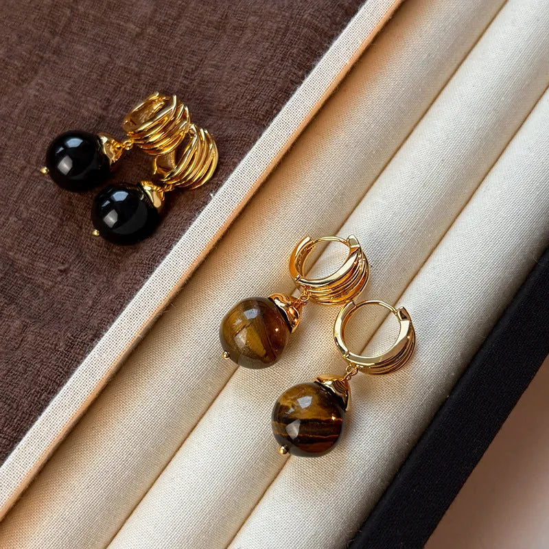 A pair of round geometric tigereye gemstone earrings with real gold plating in a French retro style.