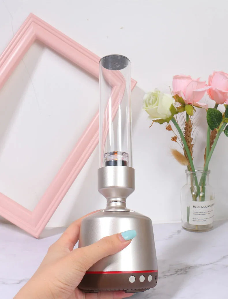 White silver Bluetooth speaker night light with candlelight effect and modern simple design