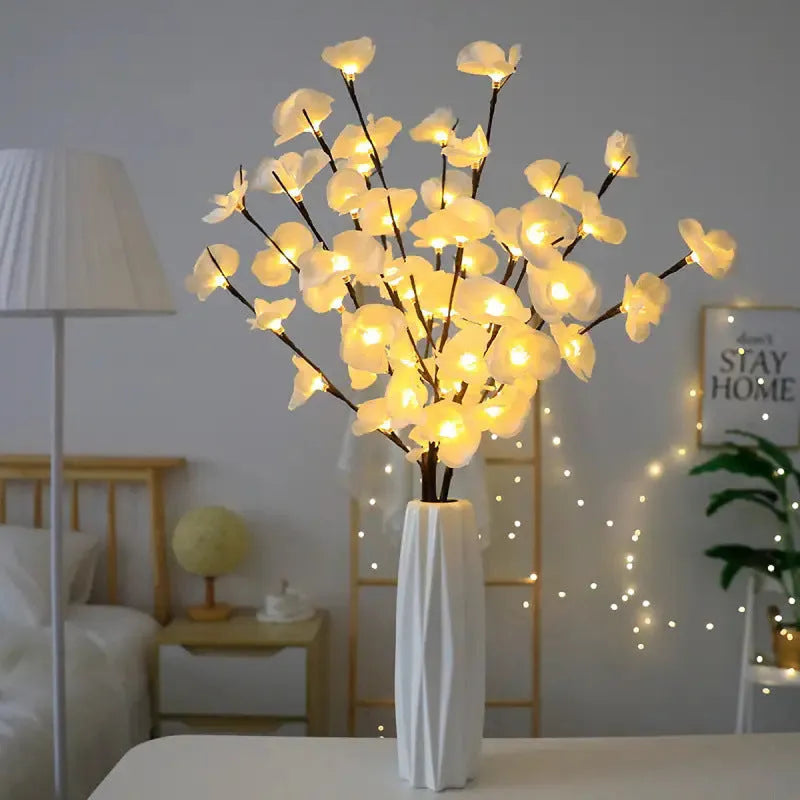 Pink LED Phalaenopsis orchid branch decorative light measuring 65cm long for bedroom walls.