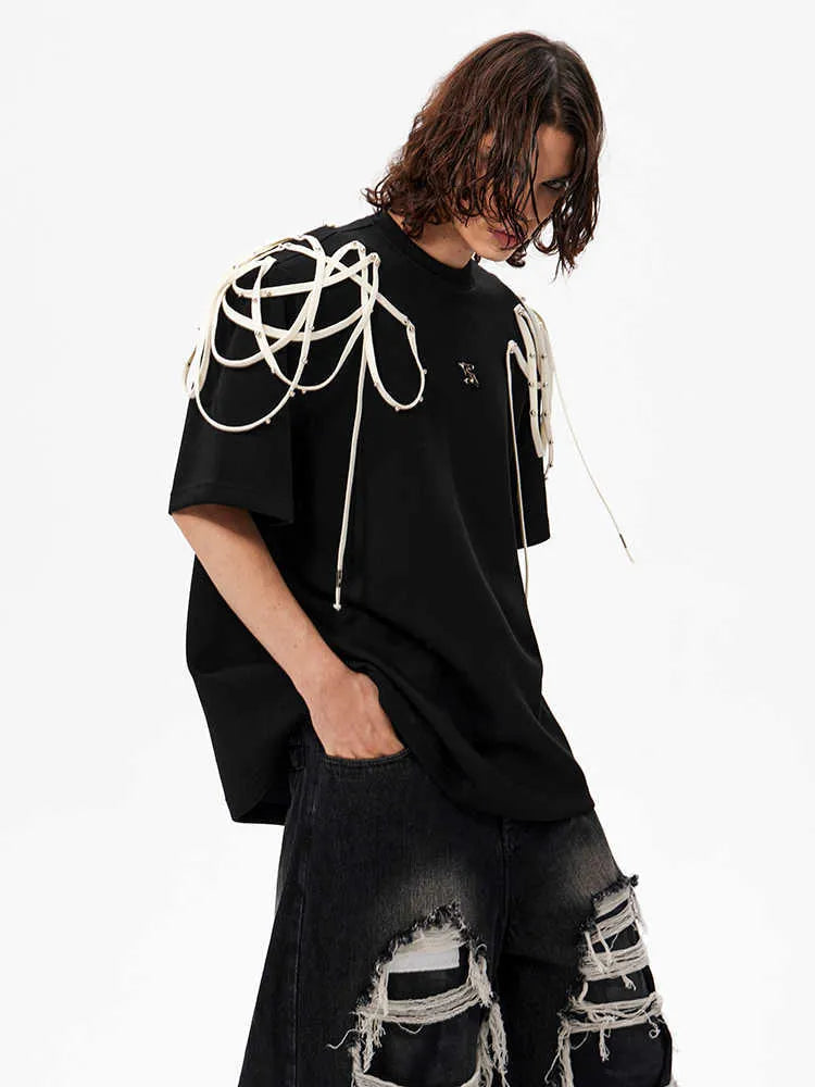 Black short sleeve T-shirt with rivet ribbon padded shoulder detail and loose round neck fit