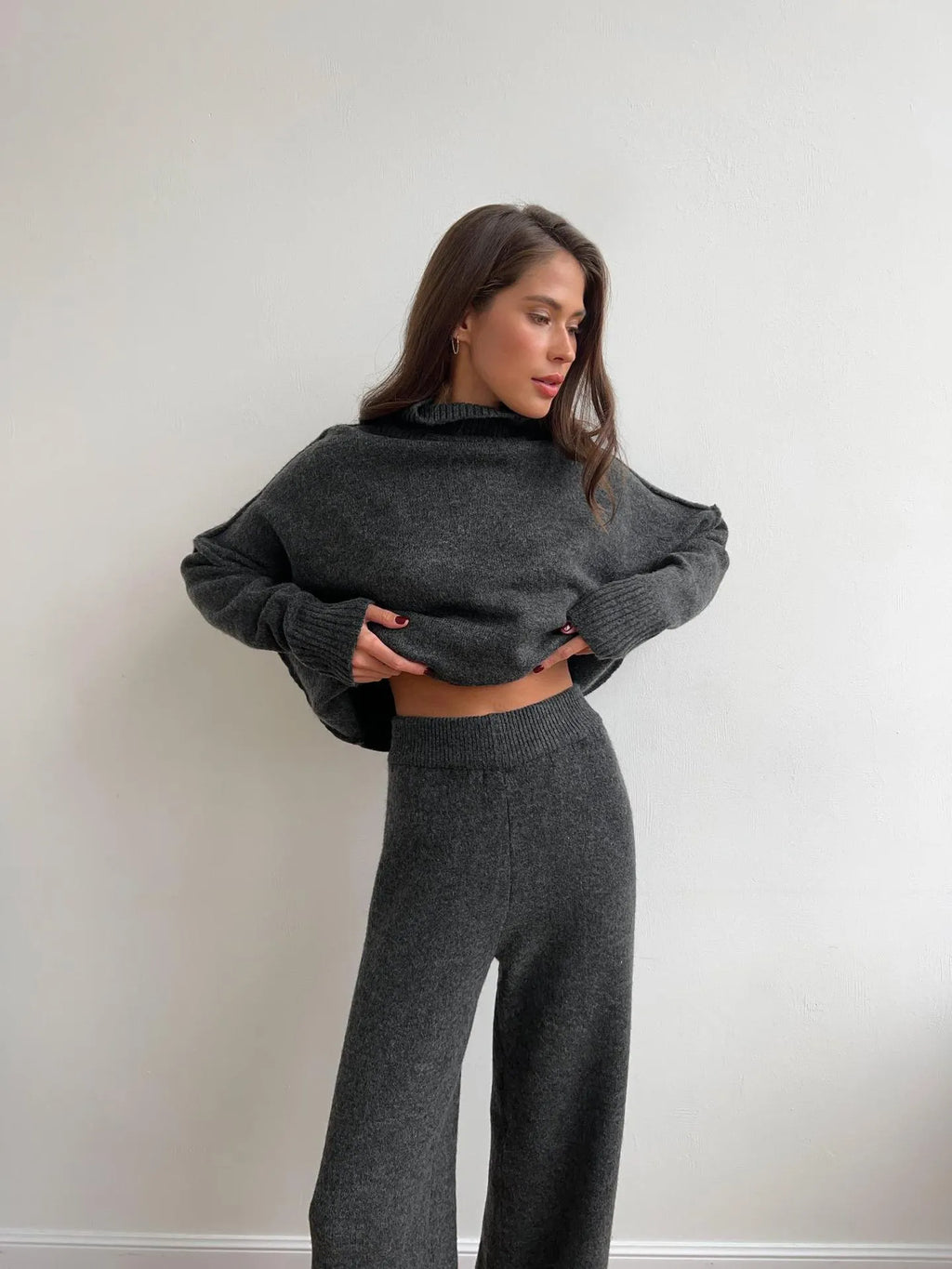 Women's acrylic knit suit set with side-slit sweater and matching trousers in dark gray