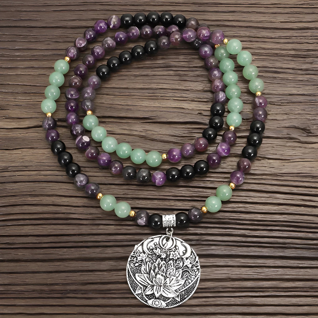 Dongling Long adjustable stone bead necklace with alloy lotus pendant and matching bracelet.