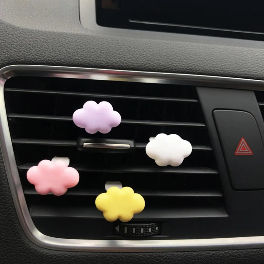 Resin cartoon Baiyun cloud car air freshener clip in light green, shown attached to a car air vent.