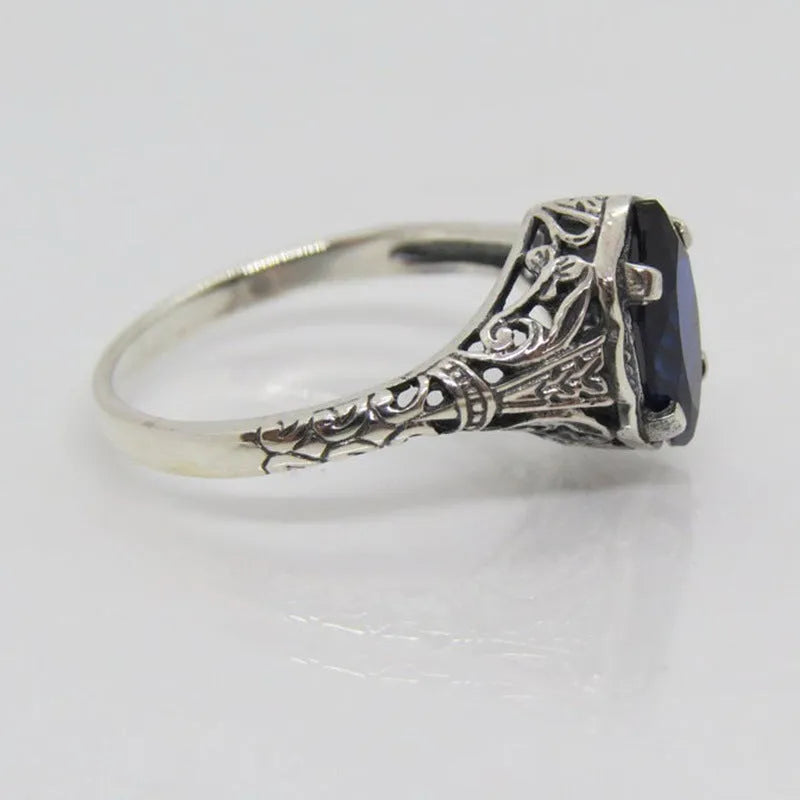 Women's silver geometric hollow-out alloy ring showing detailed pattern and zircon elements