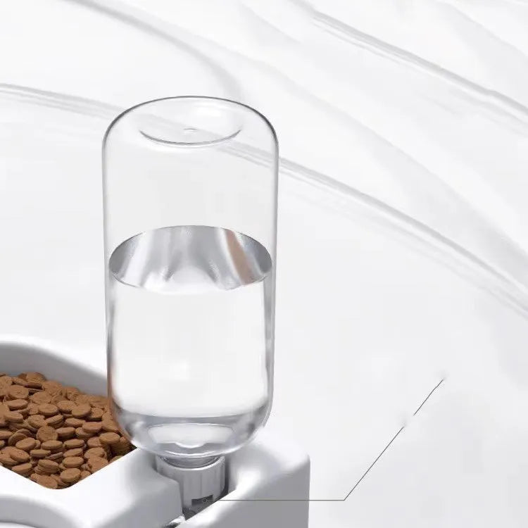 White food-grade plastic pet water fountain for cats and dogs on a countertop.
