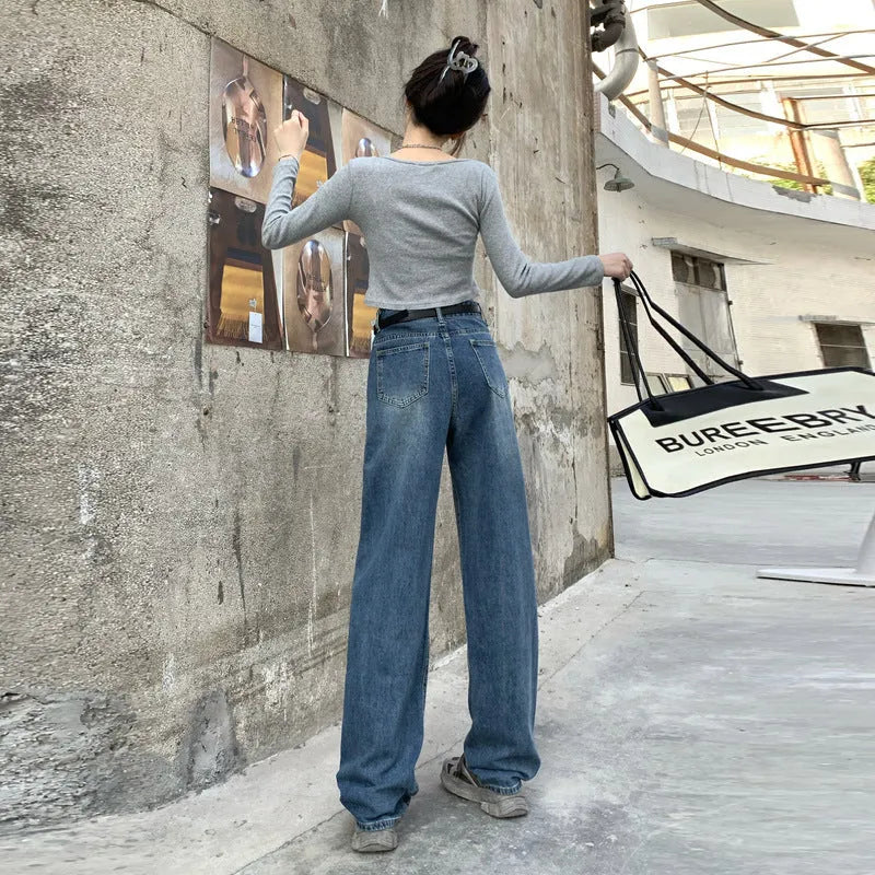 Women's high waist straight leg jeans in a retro blue wash, showcasing the denim fabric and cut.