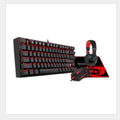 Monochrome wired mechanical gaming keyboard set with green axis switches, mouse, mouse pad, and headphones in coordinated black