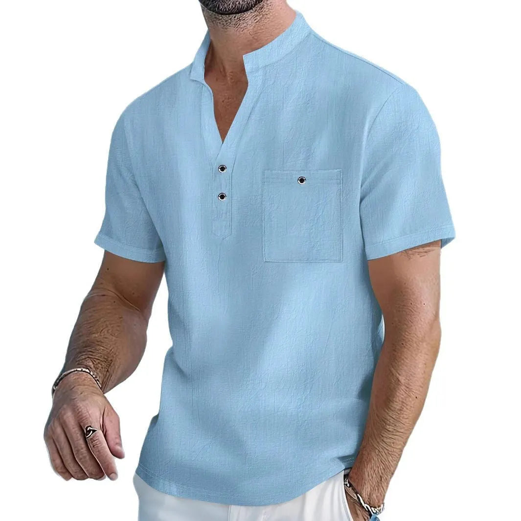 Man wearing a light-coloured linen stand collar t-shirt with short sleeves in a loose fit