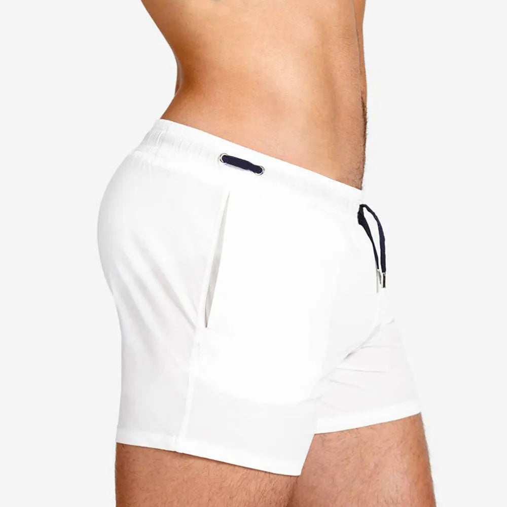 Solid colour sports shorts with mesh lining in Army Green, shown flat.