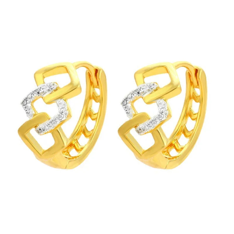 Gold electroplated geometric hollow-out earrings with ear clip fastening on white background