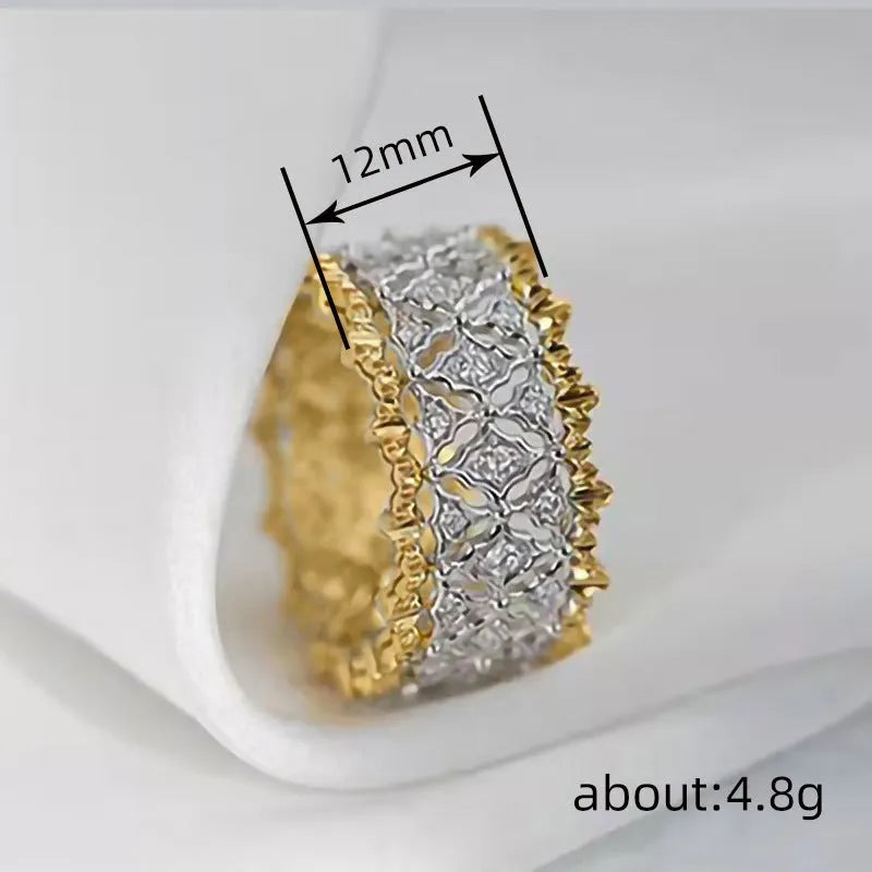 Geometric two-tone copper ring with a round zircon stone, shown in gold colour.
